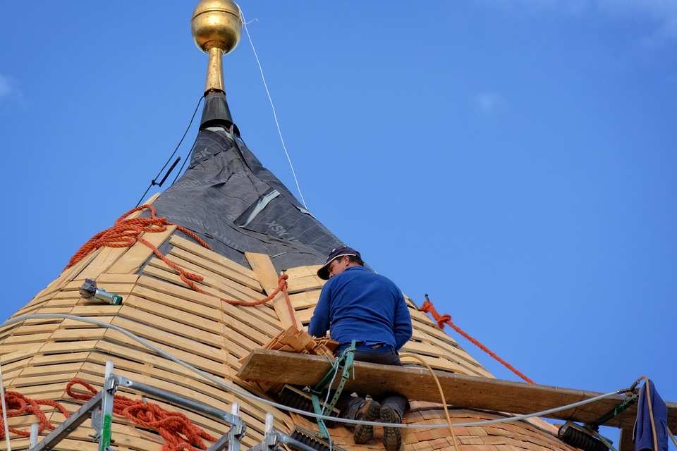 man installing roof